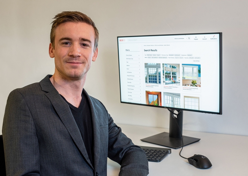 Ace Lab founder Dries Carmeliet sits at a desk in front of a computer.